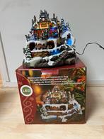 Kersttafereel met verlichting, muziek en rijdende trein. ., Ophalen
