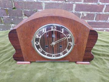 Art Deco schoorsteenpendule met coromandelhout. beschikbaar voor biedingen