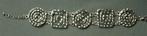Armband – zilverkleurig Griekse symbolen z.g.a.n., Staal, Ophalen of Verzenden, Zo goed als nieuw, Met bedels of kralen