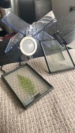 Boekensteun klokje fotolijstjes, Ophalen