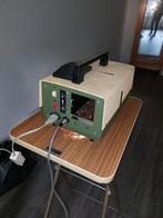 Dia projector met statief en scherm, Ophalen