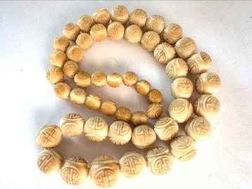 Vintage Chinese ketting van gekerft been beschikbaar voor biedingen