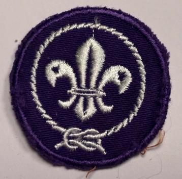 Wereldscouting embleem WOSM – paars/wit lelie beschikbaar voor biedingen