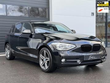 BMW 1-serie 116i Sport Black Org NL | Leder | Cruise | Navi beschikbaar voor biedingen