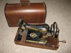 Singer handnaaimachine met koffer, Ophalen