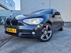 BMW 1-serie 114i Business+ Leer, Xenon, Navi (bj 2012), 1-Serie, Achterwielaandrijving, Gebruikt, Zwart