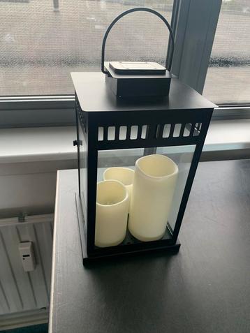 Te koop 2 solar led 3 kaarsen in zwarte lantaarn beschikbaar voor biedingen