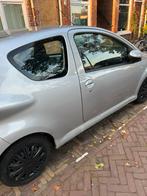 Toyota Aygo 1.0 12V Vvt-i 3DRS MMT 2007 Grijs, Auto's, Voorwielaandrijving, 4 stoelen, 68 pk, Handgeschakeld