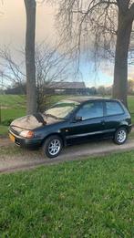 Toyota Starlet 1.3 16V 1998 Zwart, Auto's, Toyota, Voorwielaandrijving, Stof, 4 cilinders, Starlet