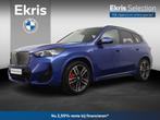 BMW iX1 eDrive20 67 kWh | M Sport Pro | Travel Pack | Comfor, Auto's, BMW, 750 kg, Met garantie (alle), Blauw, 204 pk