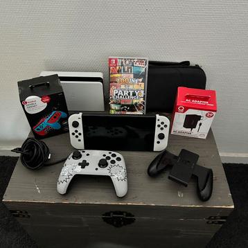 Nintendo Switch OLED + game & div accessoires beschikbaar voor biedingen