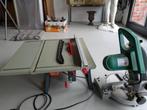 2 zaagmachines, Ophalen