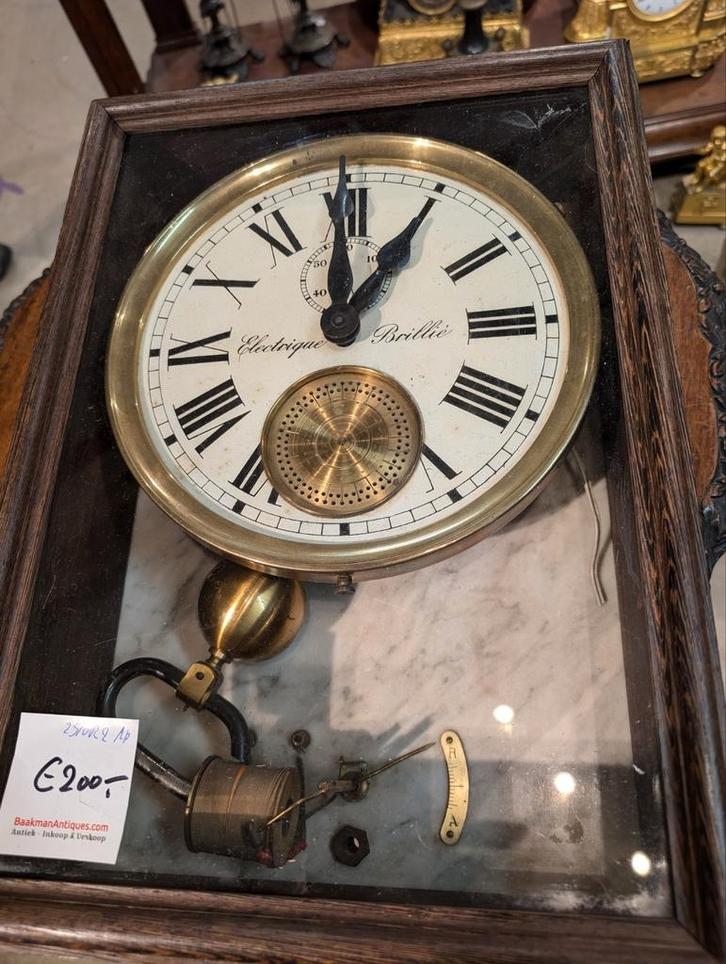 Elektrische klok brillie. €200., Antiek en Kunst, Antiek | Klokken, Ophalen