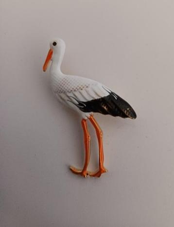 Goudkleurige broche ooievaar beschikbaar voor biedingen