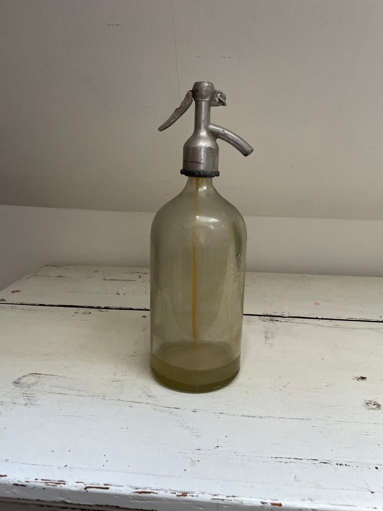 Brocante spuitfles, Ophalen