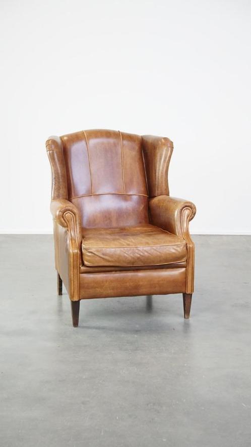 Tijdloze en comfortabele oorfauteuil gemaakt van rundleer, Huis en Inrichting, Fauteuils, Gebruikt, Leer, 75 tot 100 cm, 75 tot 100 cm