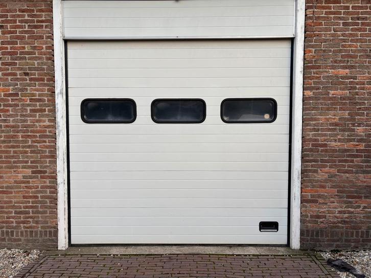 Debo sectionaal deur  elektr bediend., Doe-het-zelf en Verbouw, Rolluiken, Zo goed als nieuw, 200 cm of meer, Wit, Ophalen