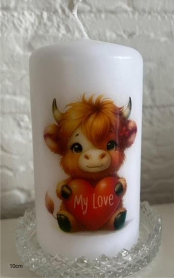 Kaars met koe. Liefde beschikbaar voor biedingen