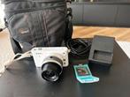 Nikon 1 J1 systeemcamera + 10–30mm lens + tas + oplader, Ophalen of Verzenden, Gebruikt, Nikon