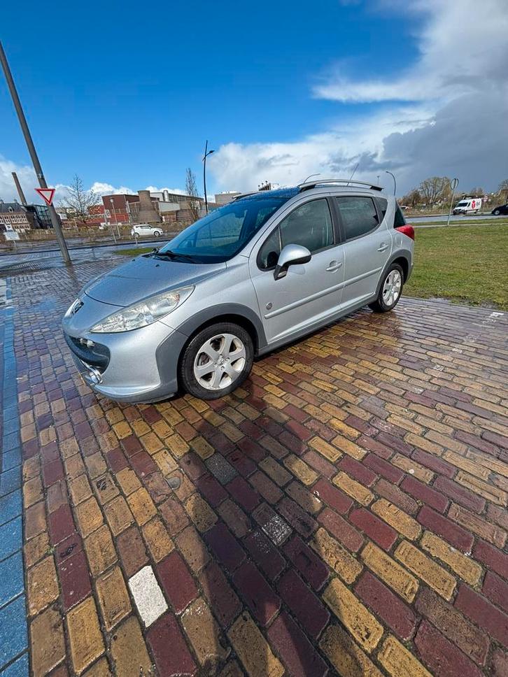 Peugeot 207 1.6 SW Outdoor 2008 Grijs 129000km NAP 3e eig, Auto's, Peugeot, Particulier, Airbags, Airconditioning, Boordcomputer