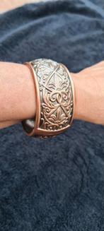 Te koop nieuwe bronskleurige metalen armband, breedte is 3cm, Ophalen of Verzenden, Nieuw, Bruin, Staal