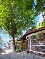 Chalet. Camping met zwembad Porlezza Luganomeer noord Italie, Speeltuin