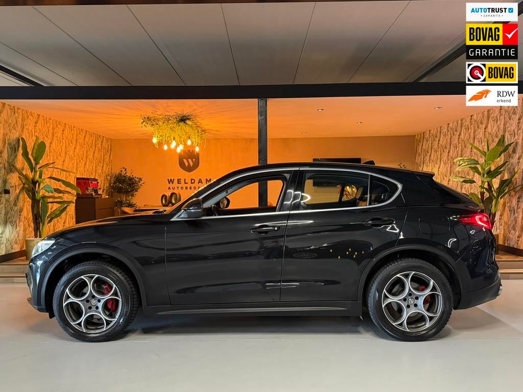 Alfa Romeo Stelvio 2.0 T AWD Super Garantie 280 PK Memory Le, Auto's, Alfa Romeo, Automaat, Zwart, 4 cilinders, Zwart