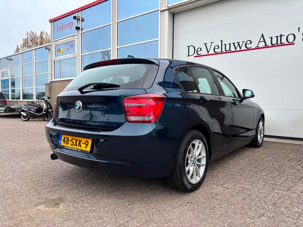 BMW 1-serie 118i Business 170PK|Sport|Cruise|Navi|Automaat, Auto's, Euro 5, Gebruikt, Zwart, 4 cilinders