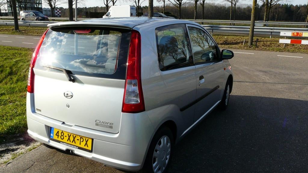 Daihatsu Cuore 1.0-12V 100th Anniversary,Airco,Stuurbekracht, Auto's, Daihatsu, 18 €/maand, 4 stoelen, Origineel Nederlands, Handgeschakeld