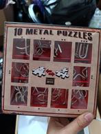 Metalen puzzels, Ophalen