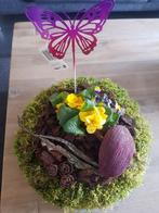 Moskrans met primula's en viooltje, Ophalen, Nieuw