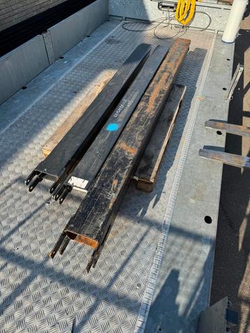 Verlenglepels lange vorken heftruck beschikbaar voor biedingen