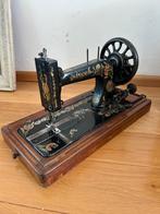 Antieke Singer naaimachine, Ophalen
