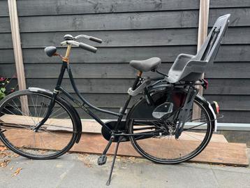 Omafiets met Fietsstoeltje beschikbaar voor biedingen