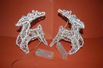 Kunststof hertjes met verlichting. / Glazen roerstaafjes beschikbaar voor biedingen