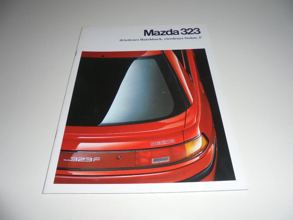 brochure Mazda 323 modellen 1991, Ophalen of Verzenden, Gelezen, Mazda