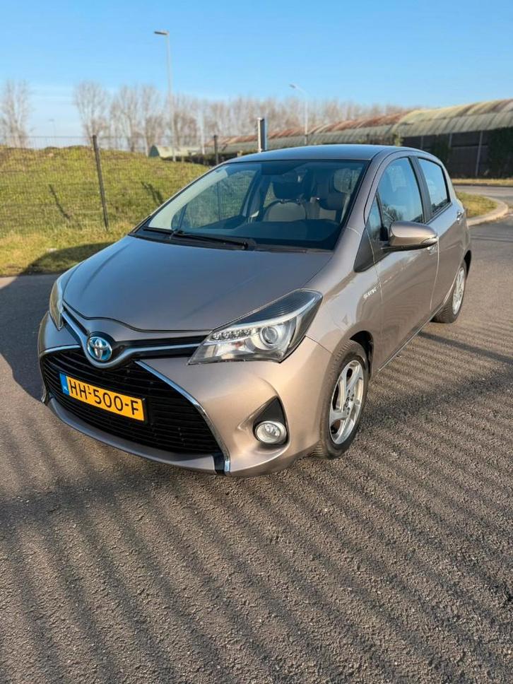 Toyota Yaris 1.5 Hybrid Lease 2015 Bruin GARANTIE !!, Auto's, Toyota, Bedrijf, Yaris, Hybride Elektrisch/Benzine, Volledig hybride