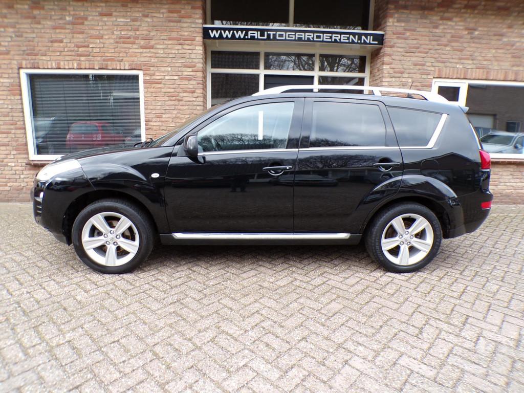 Peugeot 4007 2.4 GT 7p Automaat / Leder / Navi / 7 Persoons, Auto's, Automaat, Euro 5, Gebruikt, Zwart