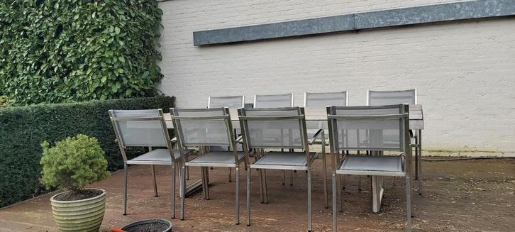 RVS design tafel merk Valeur met 8 stapelbare stoelen, Tuin en Terras, Tuinsets en Loungesets, Gebruikt, Ophalen