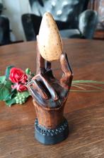 houten sculptuur Hand van God, Ophalen