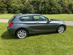 BMW 1-Serie 116I High Executive Aut8 2014 3de eigenaar, 65 €/maand, Zwart, 4 cilinders, 1290 kg
