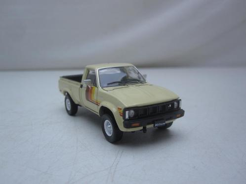 Toyota Hilux Pickup 1980  1:64 BM Creations, Hobby en Vrije tijd, Modelauto's | Overige schalen, Nieuw, Auto, Ophalen of Verzenden