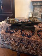 Antieke weegschaal met gewichtjes, Ophalen