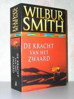 Wilbur Smith - De kracht van het zwaard (zwart met band), Boeken, Ophalen of Verzenden, Zo goed als nieuw