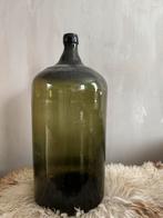 Oude groene gistfles van distilleerderij Hooghoudt, Ophalen
