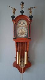 Friese staartklok met Atlas en bazuinblazers, Ophalen