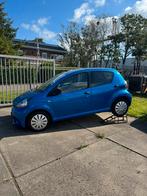 Toyota Aygo 1.0 12V Vvt-i 5DRS 2012 Blauw, Auto's, Voorwielaandrijving, Stof, Zwart, Handgeschakeld