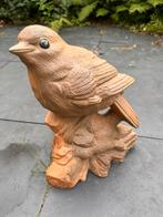 Groot tuinbeeld van een vogel, Ophalen