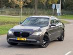 BMW 7-Serie 740d 306pk Aut. 2011 Bruin, Automaat, Euro 5, Achterwielaandrijving, Zwart