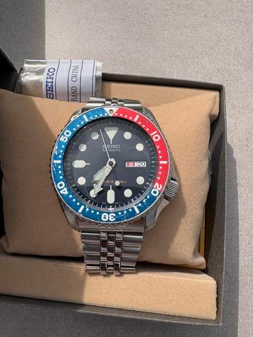 Seiko SKX009 met wijzerplaat, kroon, lunette en doos beschikbaar voor biedingen